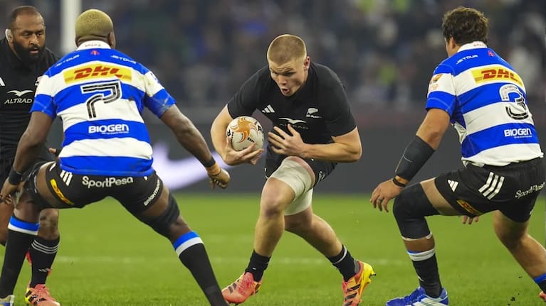 Anton Segner runs between two defenders during the All Blacks Rugby’s Greatest Rivalry Tour match against the Stormers in Cape Town, South Africa in August 2026