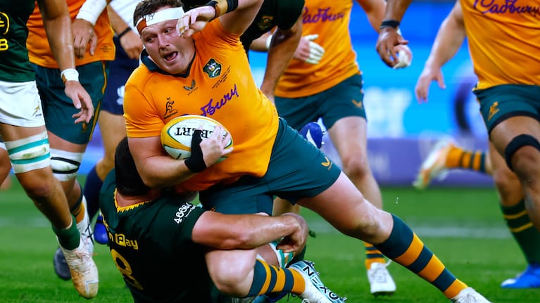 Australia's Angus Bell, center, is tackled by South Africa's Marco van Staden during their rugby union test match in Perth, Australia.