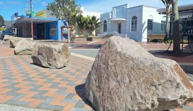 Boulders block carparks – so drivers park on footpaths