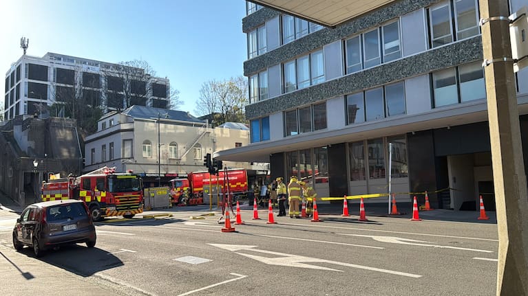 Crews outside the Scenic Hotel Dunedin City this afternoon