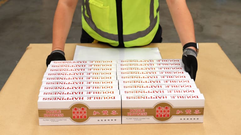Customs said the body-packing of the more than 1600 cigarettes was "an attempt to defraud Customs revenue".