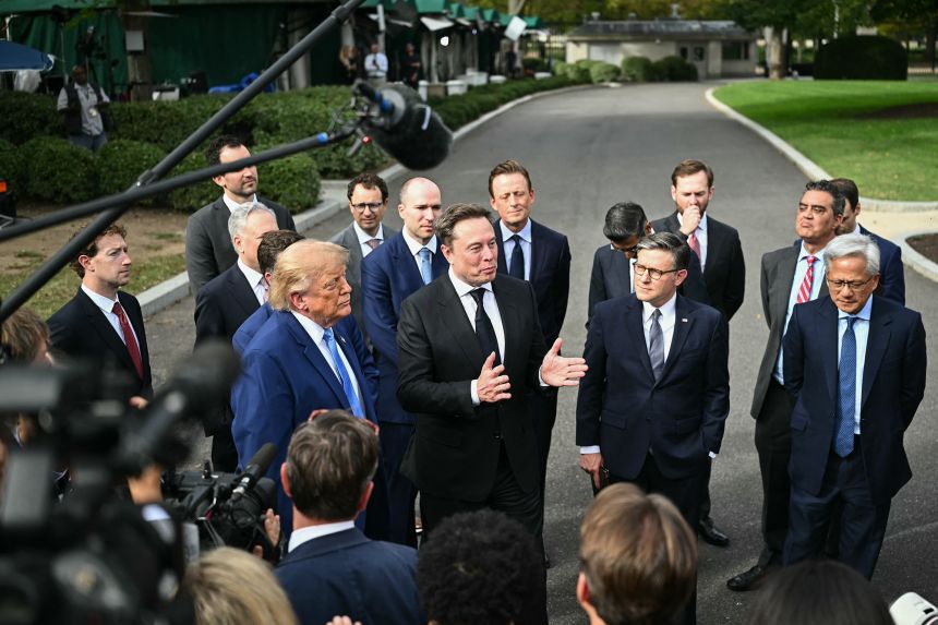 SpaceX CEO Elon Musk speaks to the press next to US President Donald Trump, House Speaker Mike Johnson and Nvidia CEO Jensen Huang after a meeting of technology executives about artificial intelligence at the White House in Washington, DC, on September 29, 2026.