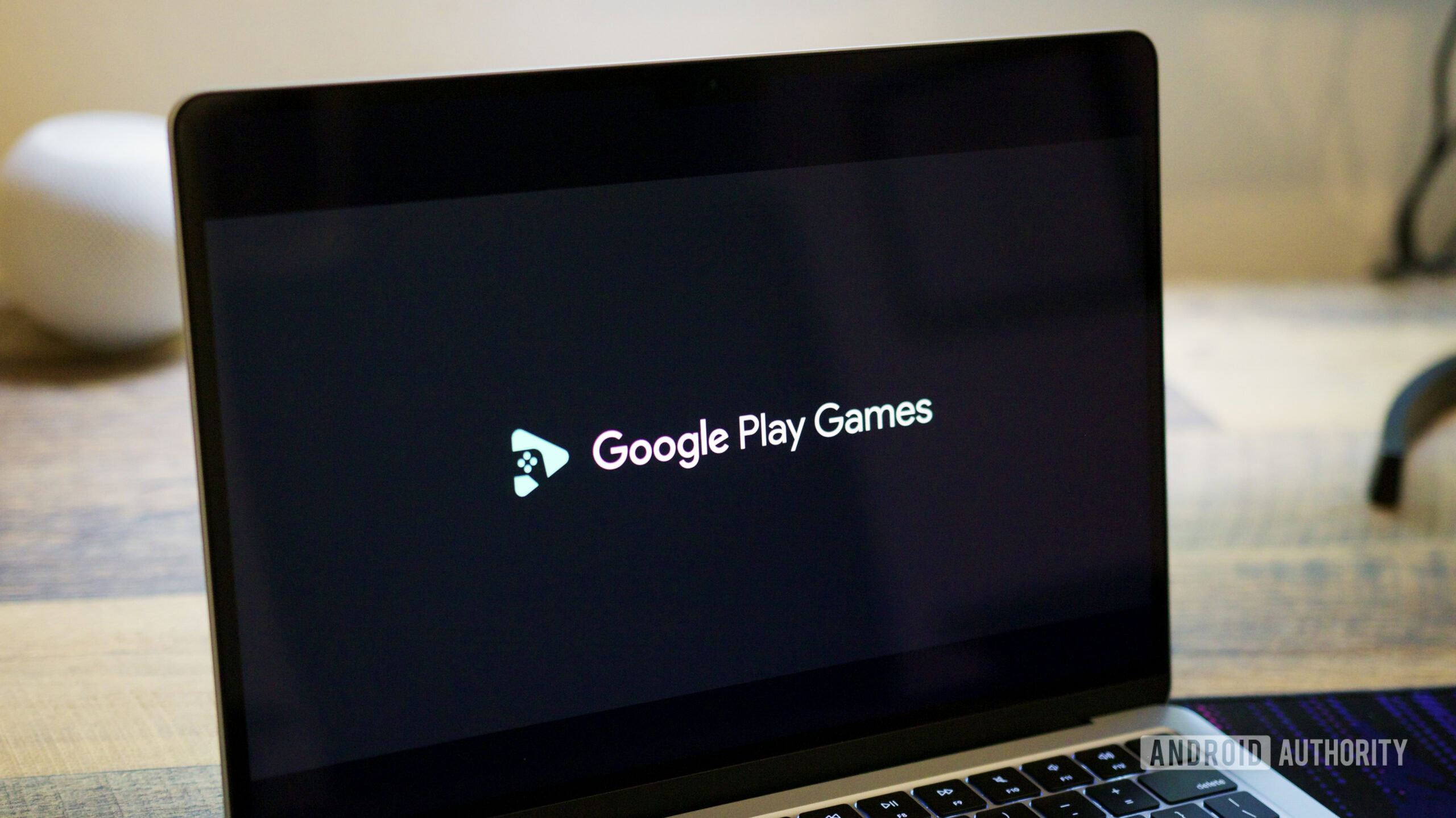google play games pc laptop hero 2 Google Play Games logo on a laptop screen.