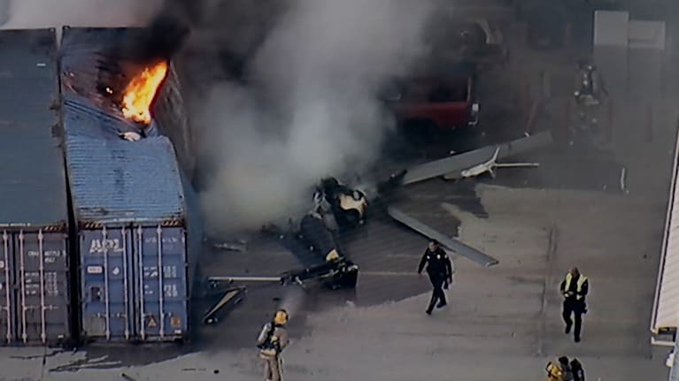 In this still image provided by KABC-TV shows first responders work the scene after a helicopter crashed near a bus crash in Chatsworth, a neighborhood in Los Angeles