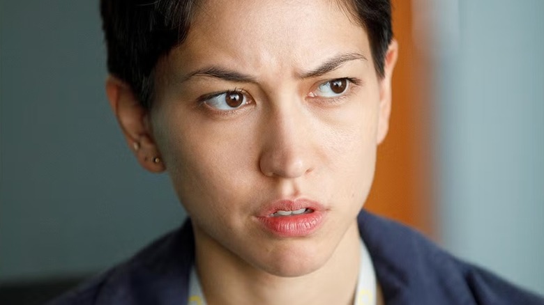 Lily Chan looks suspicious of something in 