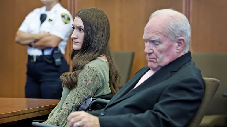 Clancy (left) sitting next to defence attorney Kevin Reddington.