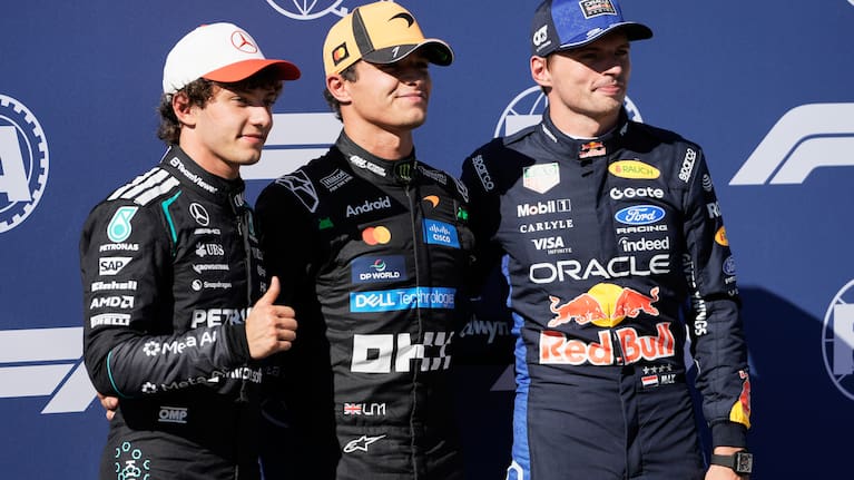 McLaren driver Lando Norris of Britain is flanked with Mercedes driver Andrea Kimi Antonelli of Italy, left, and Red Bull driver Max Verstappen of the Netherlands after the qualifying session for the Spanish Formula One Grand Prix in Madrid