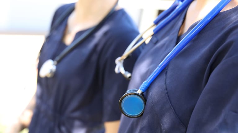 This year's flu season seems more severe because health workers are already under pressure.