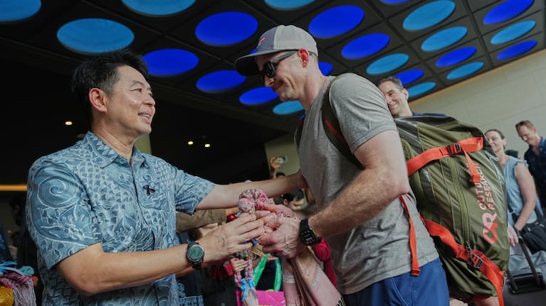 Pattaya City's Mayor Poramet Ngampichet gifts souvenirs to American service members from the USS Abraham Lincoln strike group at hotel in Pattaya, Thailand. 