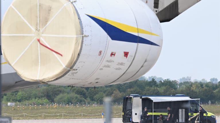 Police forensic technicians prepare to deploy an explosive-disposal robot near a Ukrainian aircraft at Leipzig/Halle Airport, in Schkeuditz, Germany, Wednesday August 5, 2026.