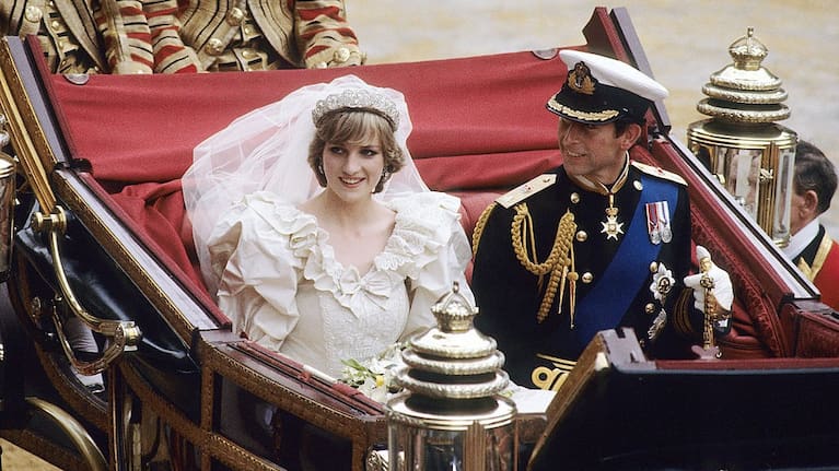 Prince Charles and Princess Diana ride in an open carriage from St. Paul's Cathedral to Buckingham Palace, following their wedding on July 29, 1981 in London, England