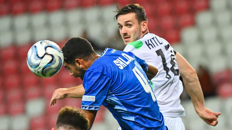 Raz Shlomo of Israel, centre, in action against Liam Kitchin of Ireland during the UEFA Nations League soccer match between Ireland and Israel in Debrecen, Hungary.