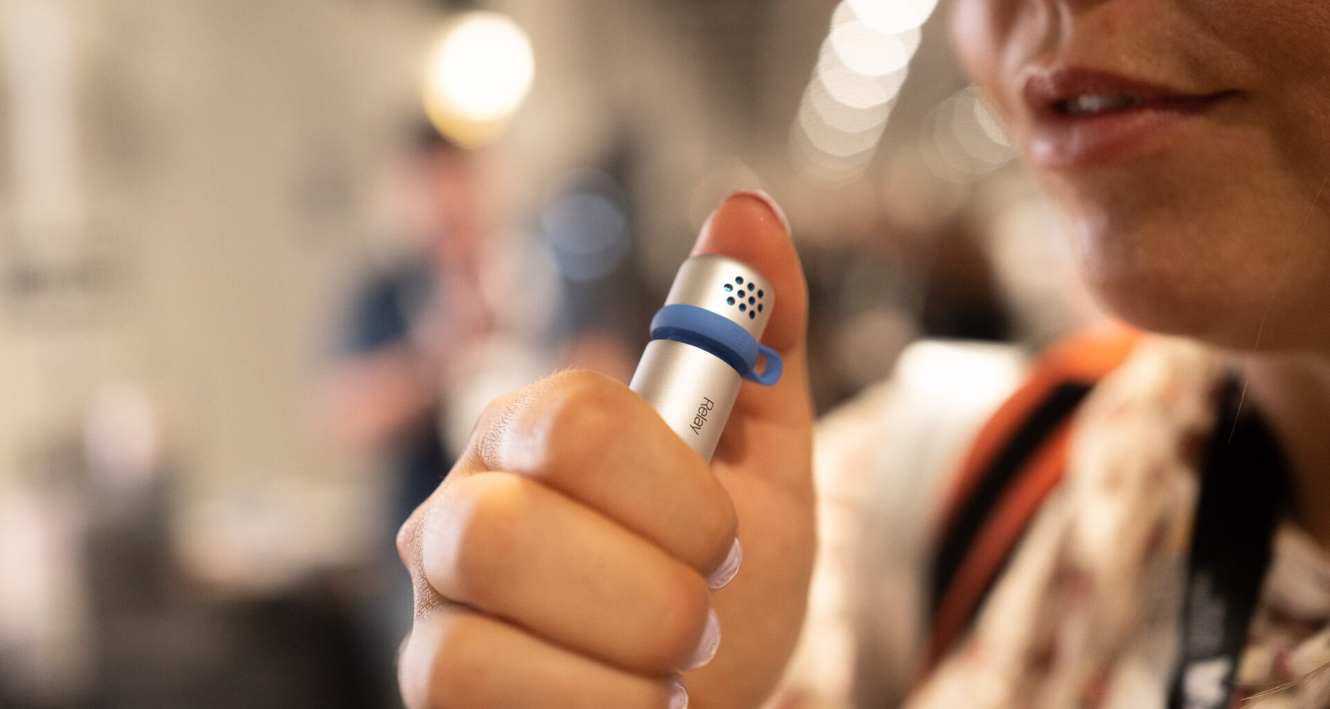 Woman holding Relay mic to her mouth