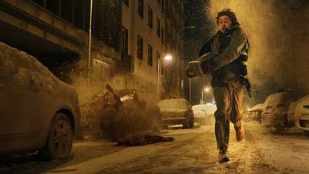Bryan (Austin Abrams) runs for his life through the street in Resident Evil 2026