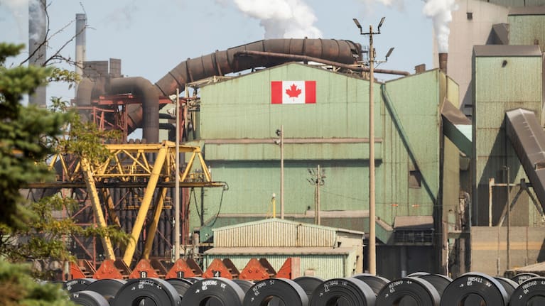 Rolled coils of steel sit in the yard at the ArcelorMittal Dofasco steel plant in Hamilton, Ontario on Thursday, August 20, 2026.