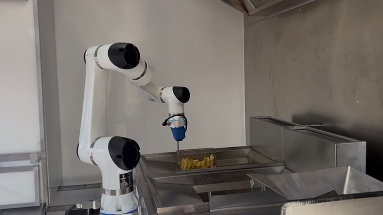 Rosie places some chips into hot oil.