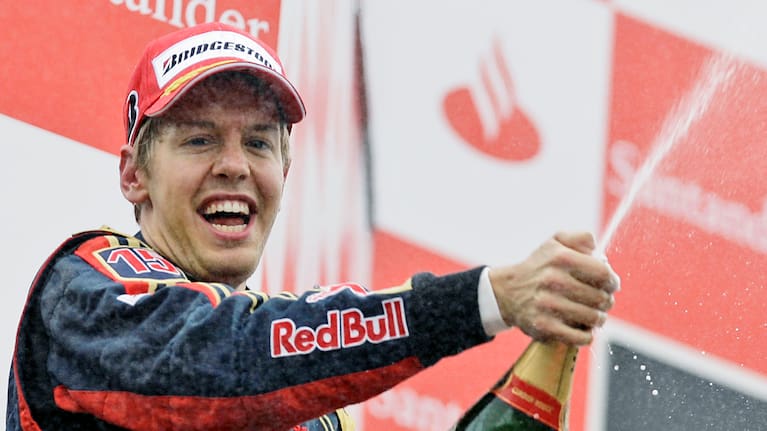 Sebastian Vettel celebrates on podium after taking his Toro Rosso to victory during the Formula One Grand Prix in Monza, Italy, Sunday, September 14, 2008.