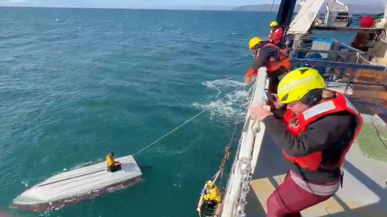 This image taken from video provided by Carlos Alexis Escartin shows a teenager being rescued by a fishing vessel Monday, September 7, 2026, in the Bering Sea near St. Lawrence Island, Alaska.