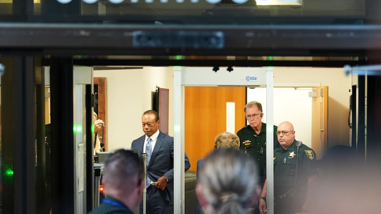 Golfer Tiger Woods arrives for a plea conference hearing in a DUI case stemming from a rollover crash in Florida in March.