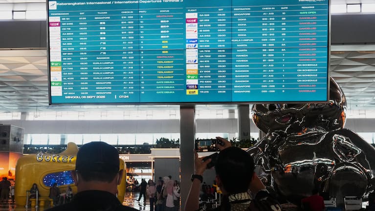 Travelers wait for their flights at Soekarno-Hatta International Airport in Tangerang, Indonesia, Sunday, Sept. 6, 2026.