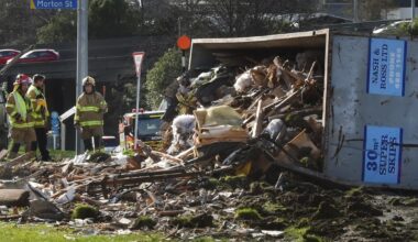 One in serious condition as truck rolls and spills load in Dunedin