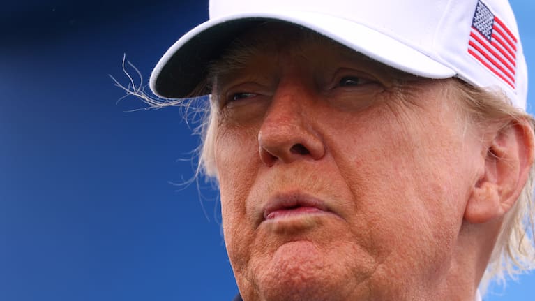 US President Donald Trump smiles after the trophy presentation of the Irish Open at the Trump International Golf Links course in Doonbeg, Ireland.