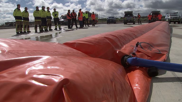 When filled with water, the tube creates a renewable dam to hold floodwater back.