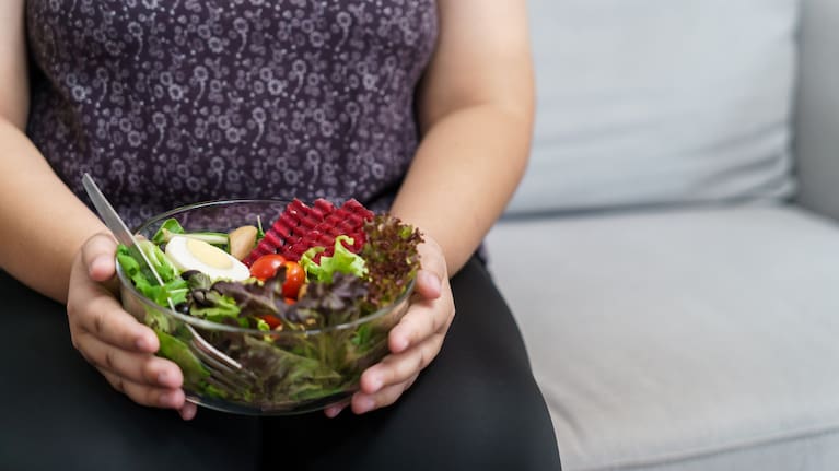 A woman with a bowl of salad (file image).