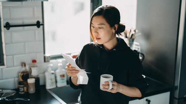 Young Asian woman managing personal banking and finance. 