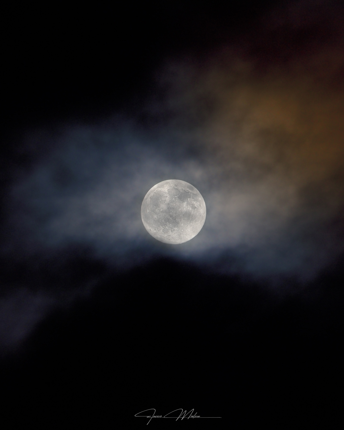 The Hunter's Moon captured in an image entitled 'Moon Between Light and Shadow' by Enrico Modica, Syracuse, Sicily, Italy, 25 October 2026, 19:45 local time. Equipment: Nikon D750 camera, Tamron 150–600mm f/5–6.3 lens, tripod Exposure: ISO 1000, 350mm f/7.1 1/40s, 18 selected RAW exposures used for lunar detail stacking