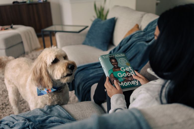 Leo, the family dog, appears interested here in money issues. But let's be real -- he's more likely angling for food or a walk.
