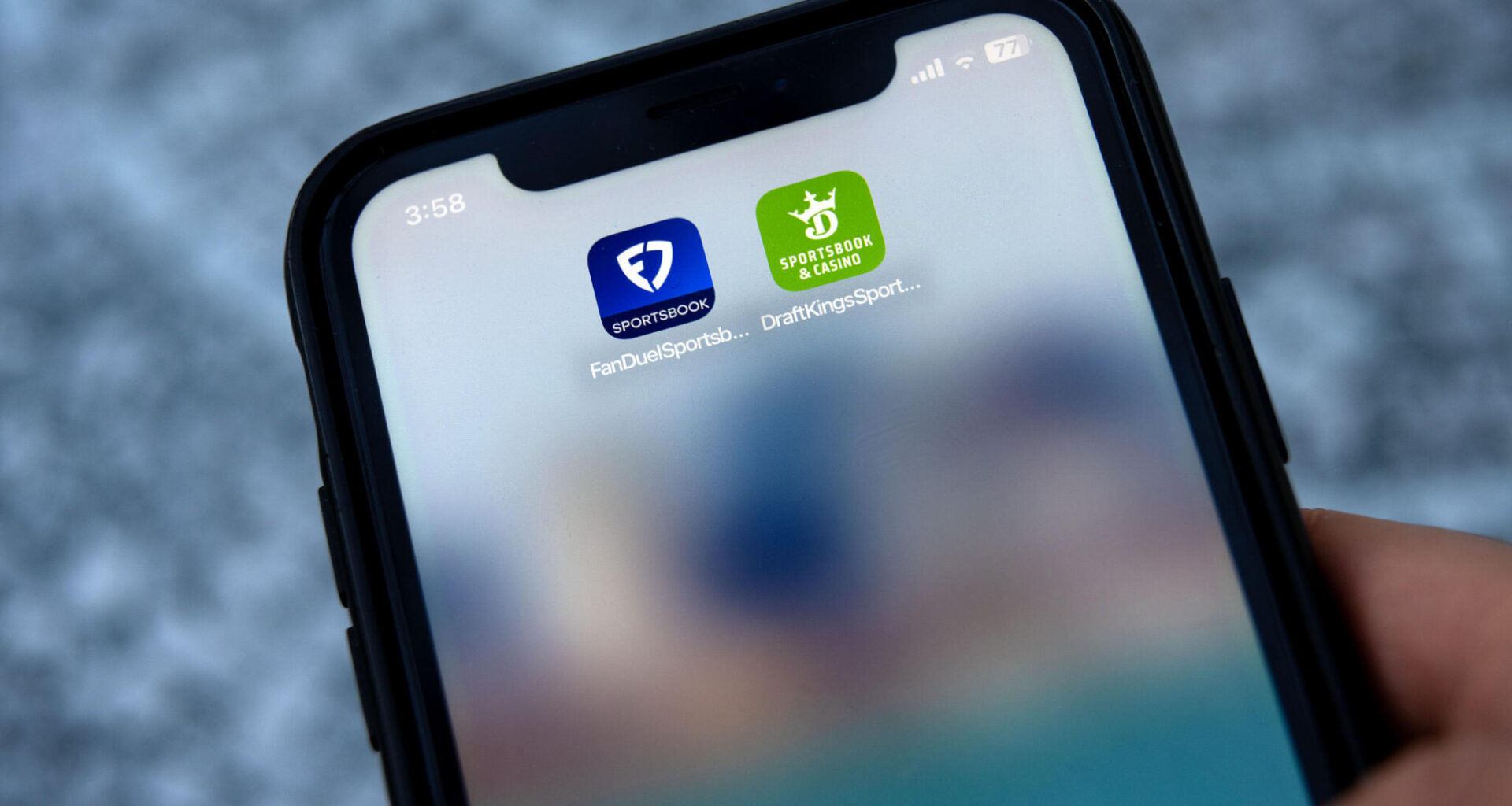 The FanDuel and DraftKings apps on a mobile phone. (Robin Lubbock/WBUR)