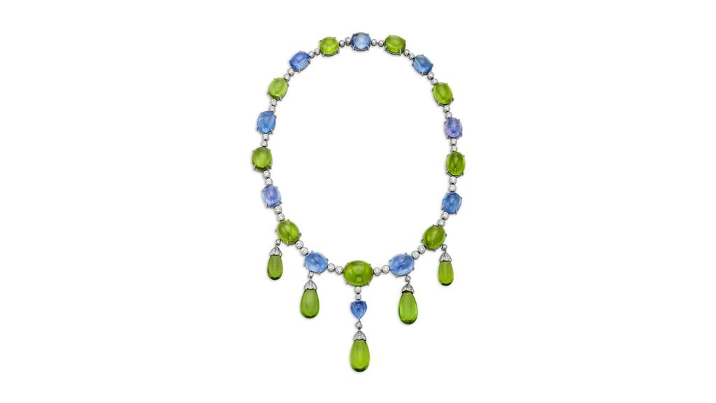 Bulgari created this necklace with oval and cabochon peridots, oval and sugarloaf cabochon sapphires, and round diamonds at Christie's image