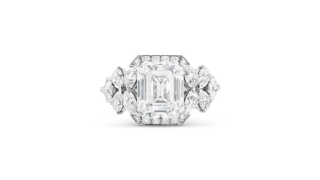 A Van Cleef & Arpels ring bearing an emerald-cut, 5.22-carat, D, VVS2 diamond center stone with approximately 2.40 to 2.60 carats of pear and round diamond accent stones at Christie's image