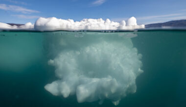 An iceberg as seen from above and below the water