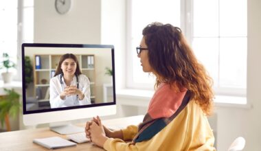 Sick woman listening recommendations and appointment having online video call with a female friendly smiling doctor using pc computer at home.