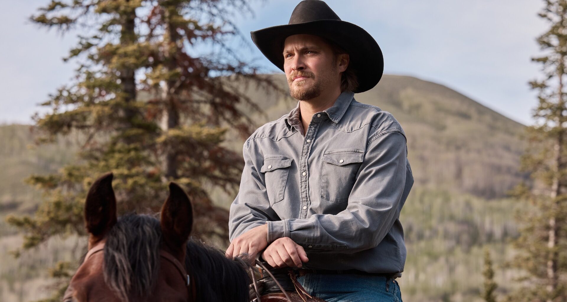 Production still of Luke Grimes on a horse from Marshals season 2.