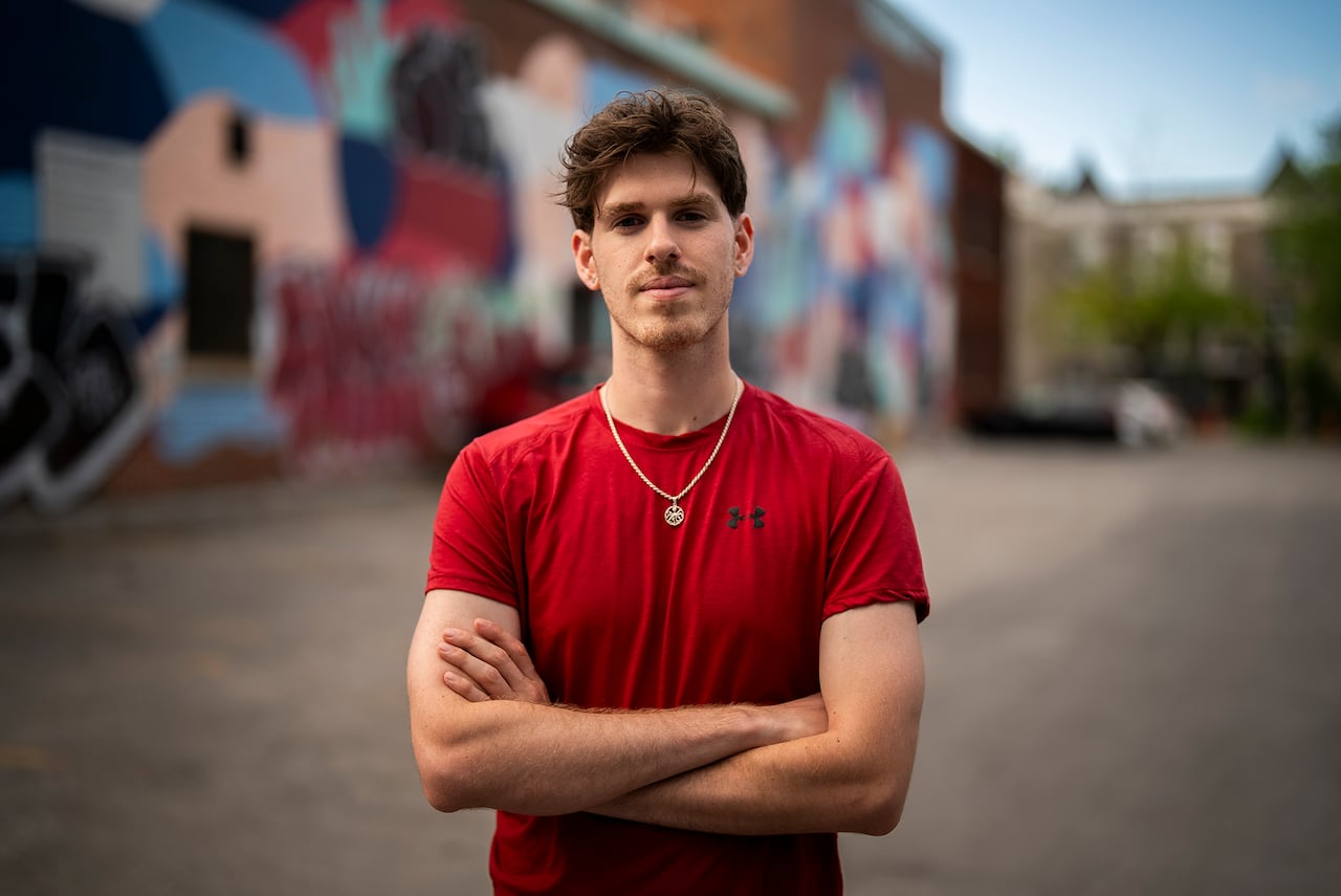 A young man in a red shirt.