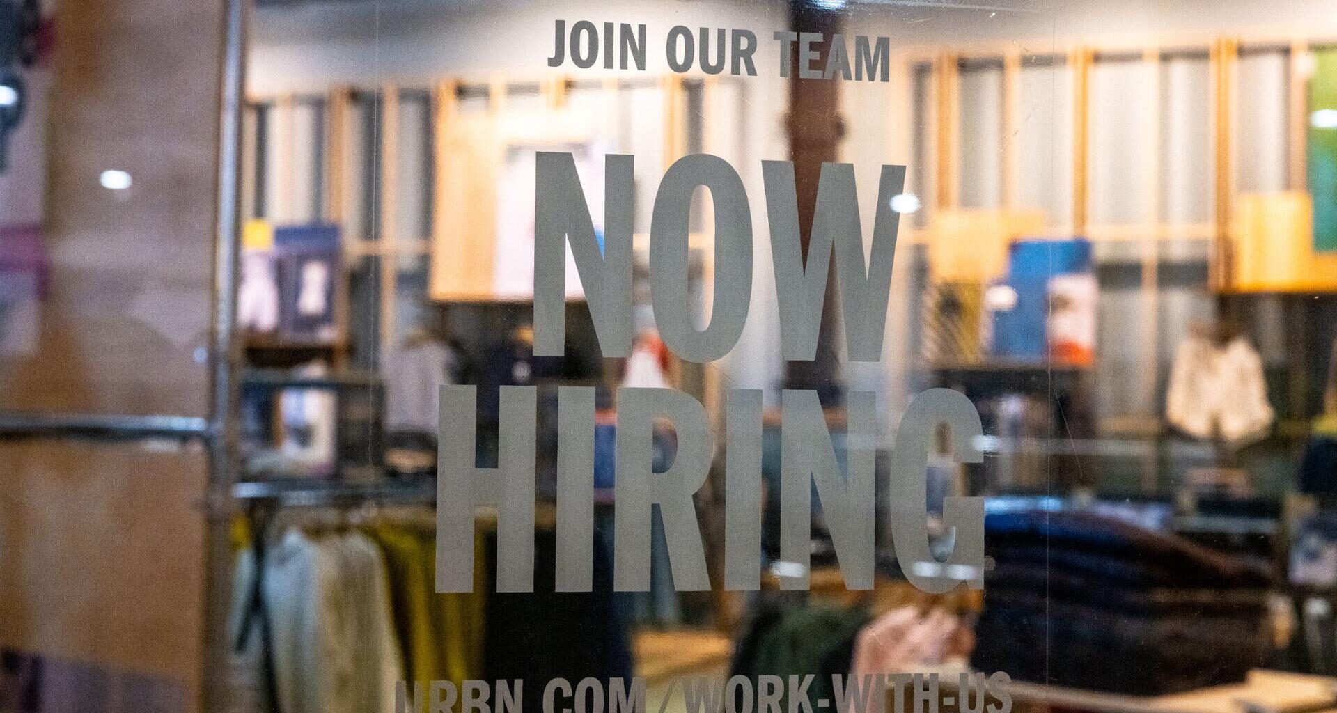 A hiring sign is posted on the exterior of Urban Outfitters at the Tysons Corner Center mall on Aug. 22, 2024 in Tysons, Virginia. Getty Images via AFP-Yonhap