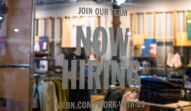 A hiring sign is posted on the exterior of Urban Outfitters at the Tysons Corner Center mall on Aug. 22, 2024 in Tysons, Virginia. Getty Images via AFP-Yonhap