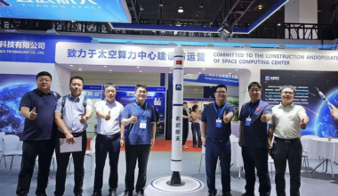 xuanwu space representatives next to rocket model at the wuxi space conference