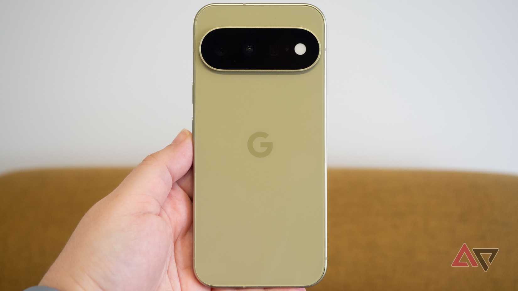 Google Pixel 11 in hand, pistachio color
