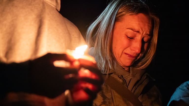 Dara Crawford cries during a candlelight vigil at Drake Park following a deadly shooting at Silver Rail Elementary School in Bend, Oregon on Thursday, October 15, 2026.