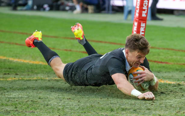 Beauden Barrett of New Zealand dives over to score.