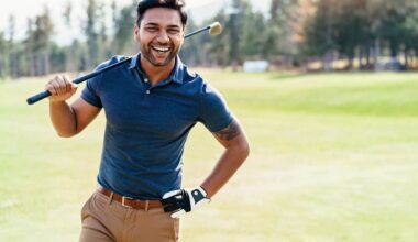 Happy golf player walks the course