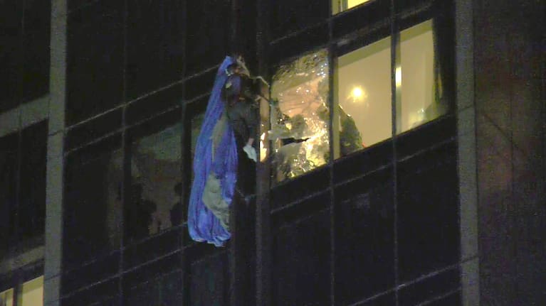 The parachutist pictured on the side of a building in Auckland's CBD last night.