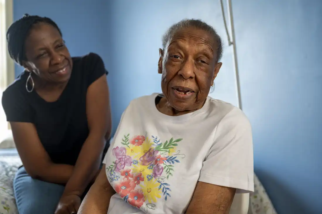 Cookie Jones, left, quit her job to provide care to her mother who has Alzheimer's disease. Caregivers often earn less as they take time off work to help aging family members.