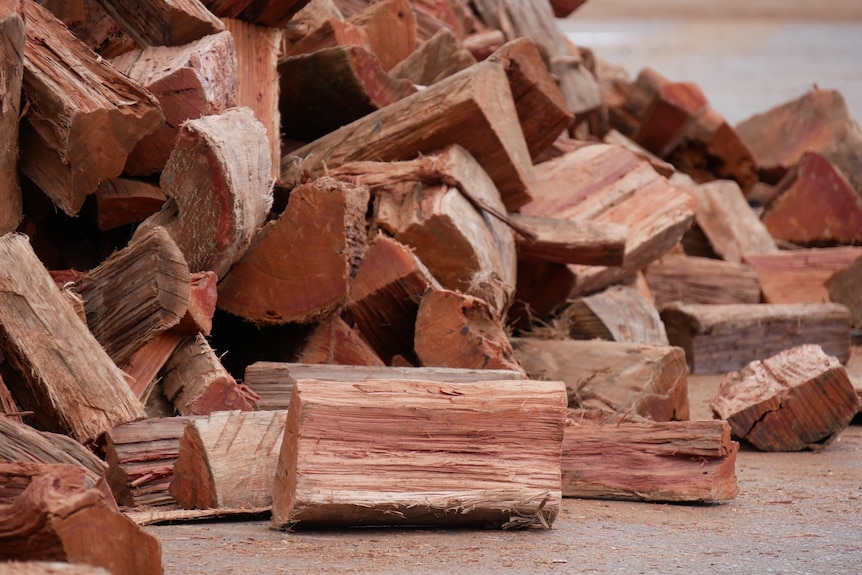 Split firewood lies in a pile.