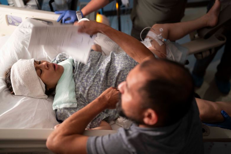Mayra Verdin is fanned during her 11-hour labor to give birth to her fourth child.