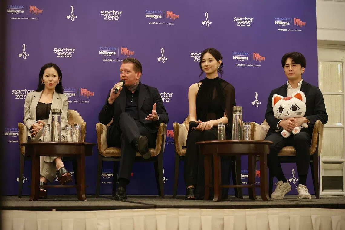 (From left) Sayako Niimi, director and lead global partnership at Sector Zero; Luke Timmins, merchandise and licensing director at Atlassian Williams F1 Team; K-pop idol Tzuyu; and Tassei Shimoie, manager of TV anime Dan Da Dan at the press conference of the Atlassian Williams x Dan Da Dan collaboration event at Fraser’s House on Oct 9.